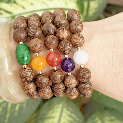 Vòng tay phong thủy hạt gỗ tròn mix 1 hạt đá thiên nhiên và bi bạc kết dây thủ công