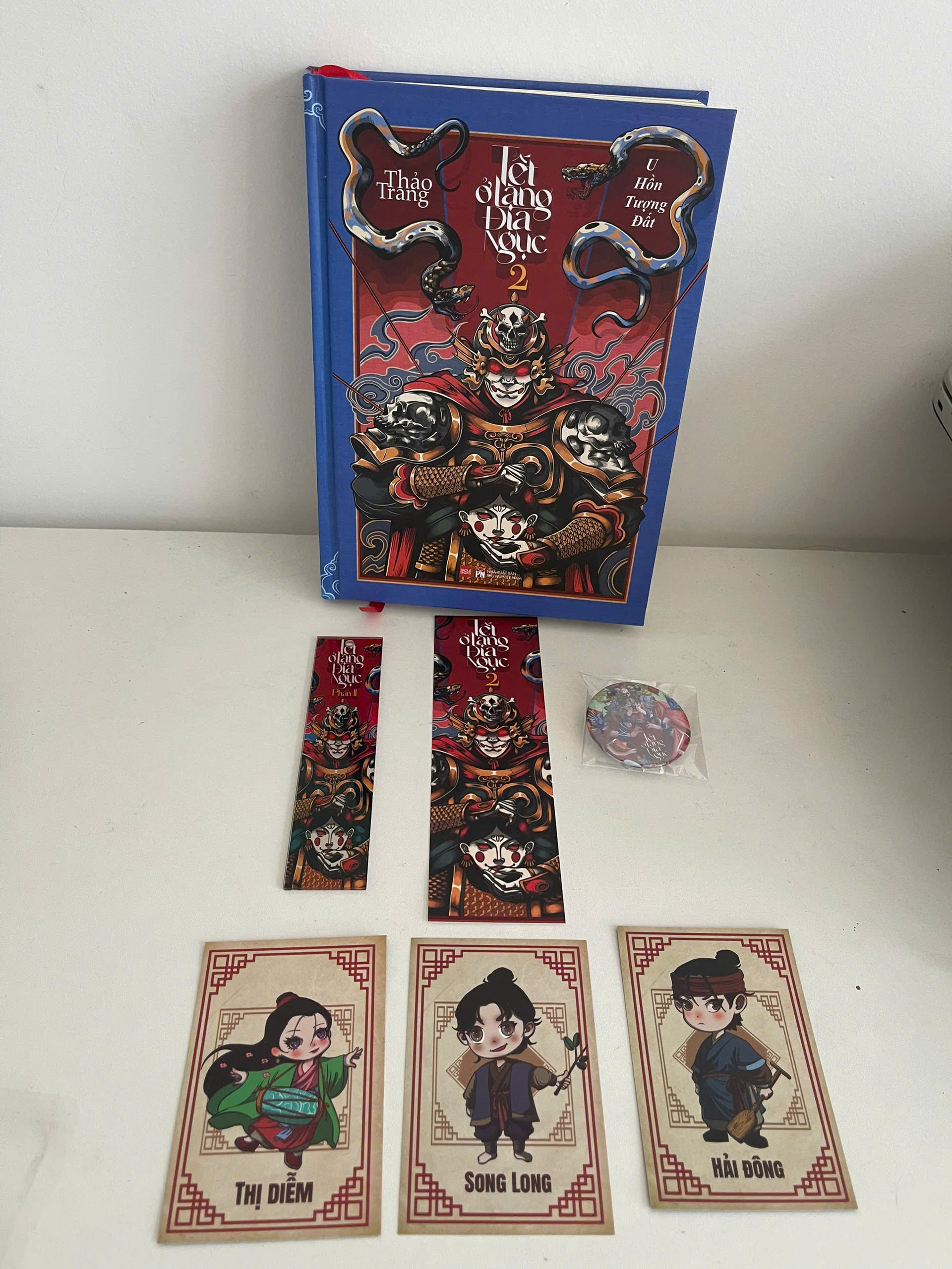 Sách - Tết Ở Làng Địa Ngục Phần 2 - U Hồn Tượng Đất - Saola Books - Thảo Trang - Combo bìa cứng và mềm - Quà bìa cứng + quà bìa mềm + 1 ảnh nam châm bìa sách (ramdom 1 trong 2 hình của bìa cứng hoặc mềm)