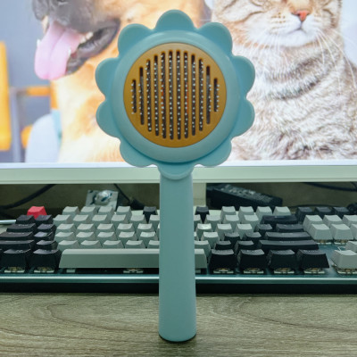 Lược chải lông gỡ rối cho chó mèo hình hoa dướng dương có nút bấm đẩy lông thừa